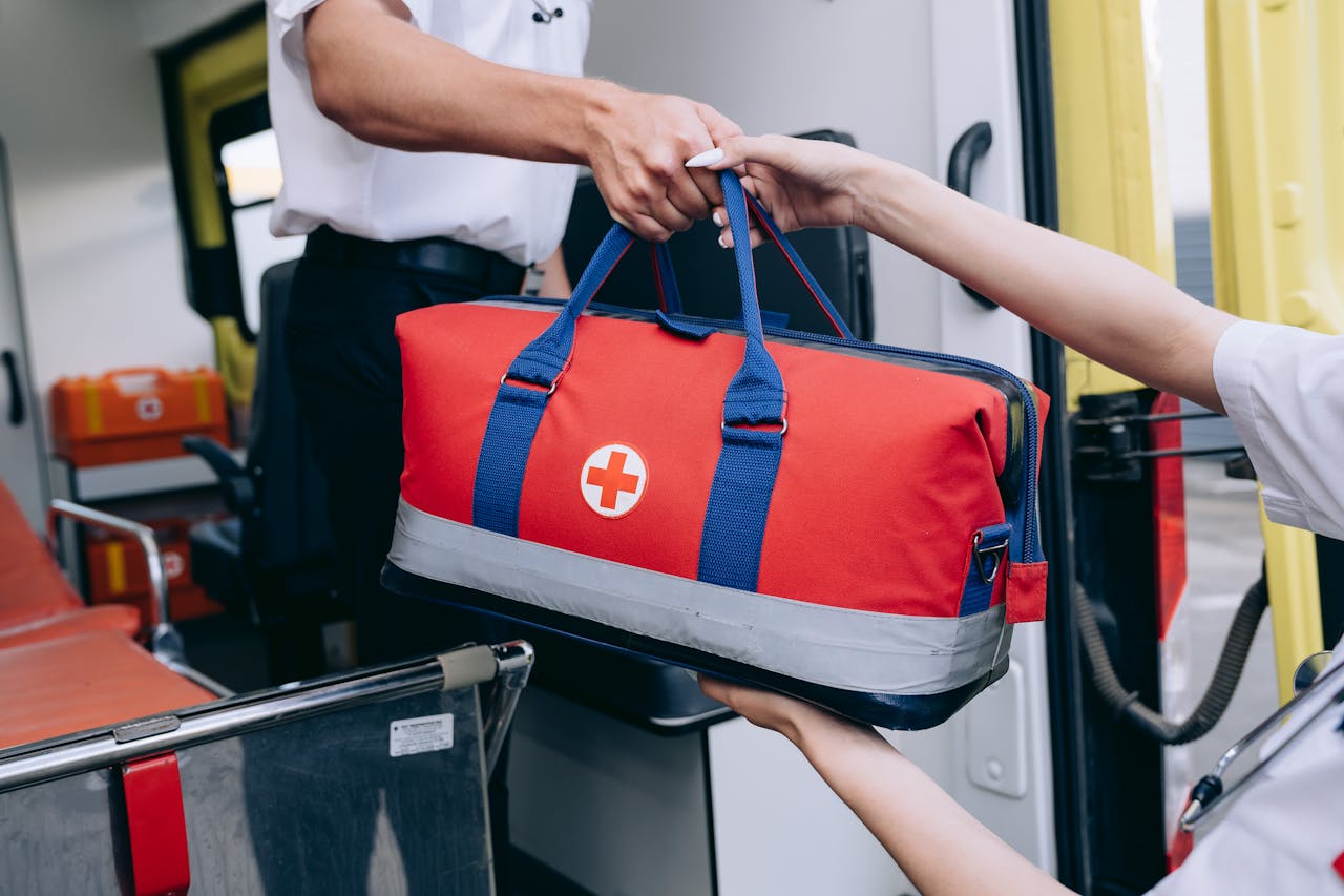 Lifeguards Holding a Rescue Bag